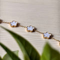 Fleur – Gold Charm Bracelet with White Flower Pendants